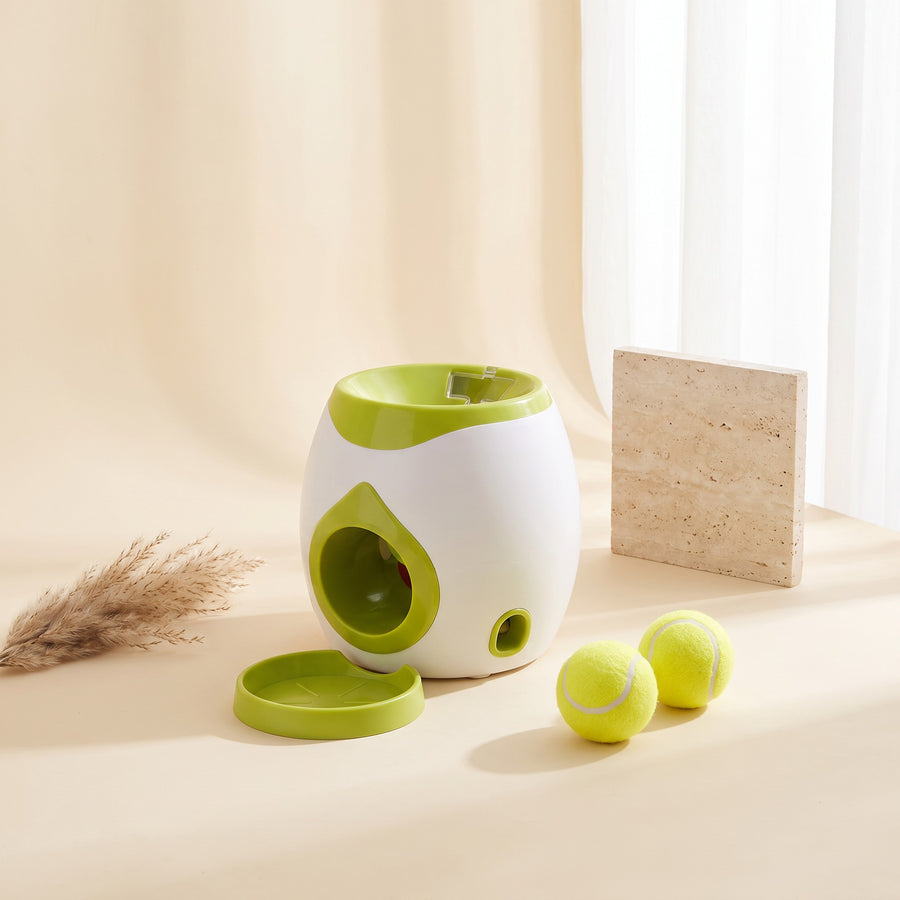 The Fetch & Reward launcher with two tennis balls