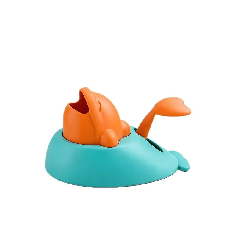 Dolphin treat launcher in orange and teal